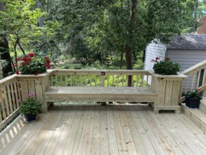 A long, newly installed wooden privacy fence with a decorative lattice top, built by Dutch Deck and Fence in Norfolk, VA.