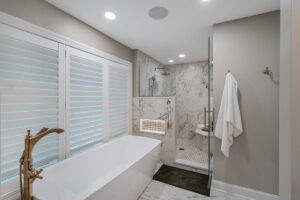 A luxurious bathroom renovation with a freestanding tub and walk-in shower by J Brothers Design- Build- Remodel, Inc. in Corcoran, MN