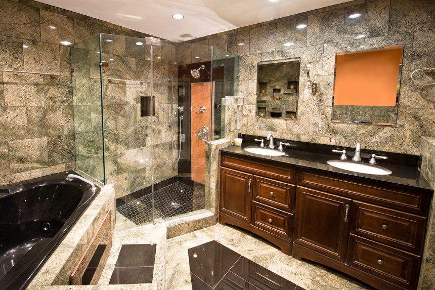 A luxurious bathroom renovation featuring a large shower and double vanity by Naugle Construction Company in Columbia, MO.