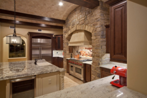 A luxurious kitchen remodel featuring stone accents and high-end appliances by Cornerstone Custom Construction LLC in Beaver Falls, PA