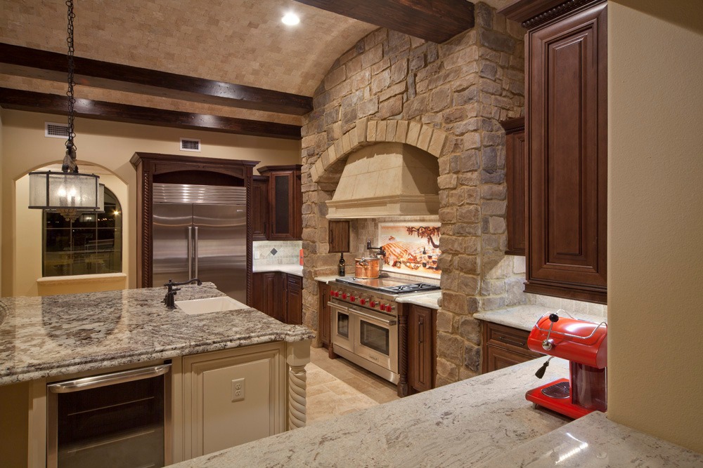 A luxurious kitchen remodel featuring stone accents and high-end appliances by Cornerstone Custom Construction LLC in Beaver Falls, PA