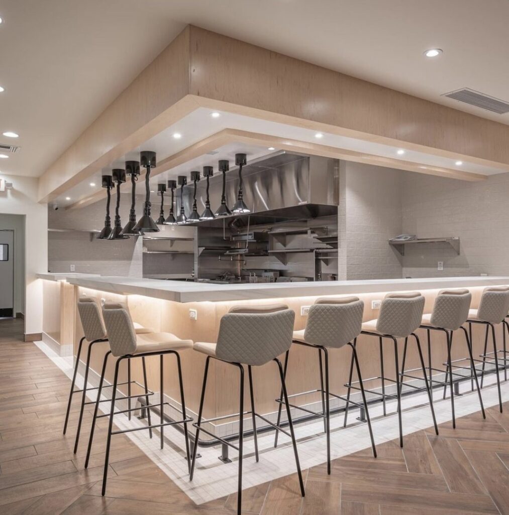 A luxurious walk-in shower with elegant stone walls installed by Oddonetto Granite & Marble LLC in Phoenix, AZ.
