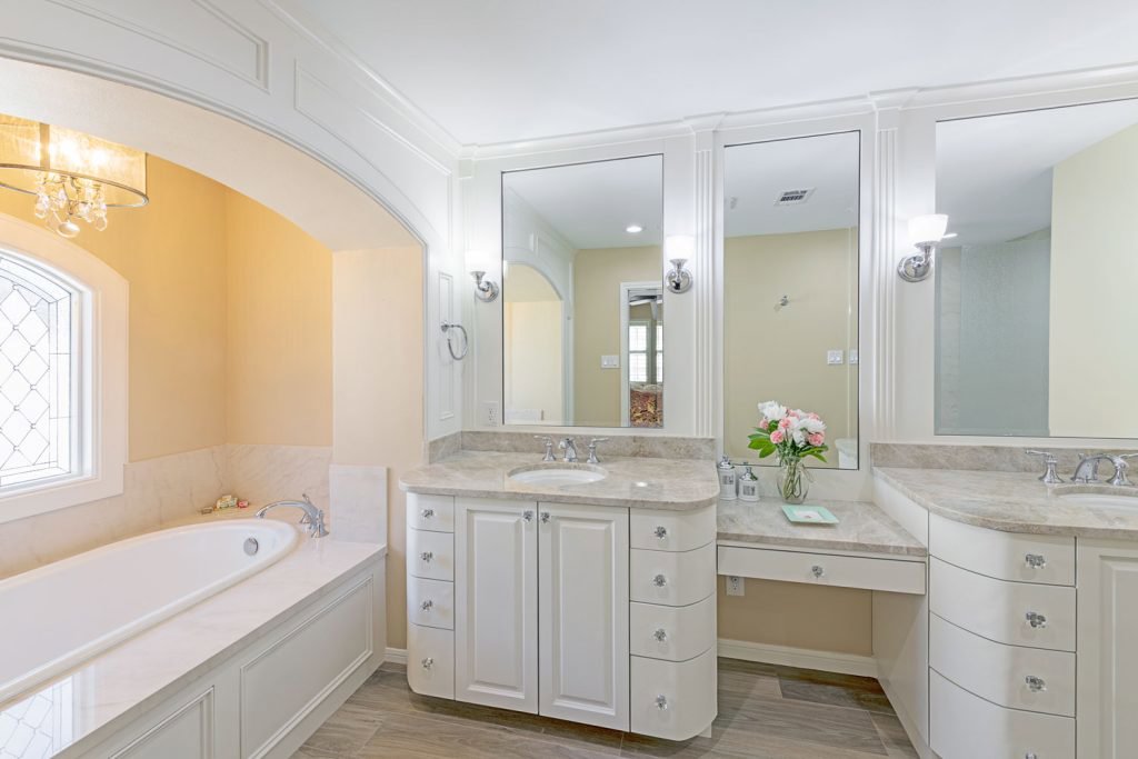 A luxurious bathroom remodel featuring a double vanity and large soaking tub by All Star Construction, Inc. in Houston, TX.