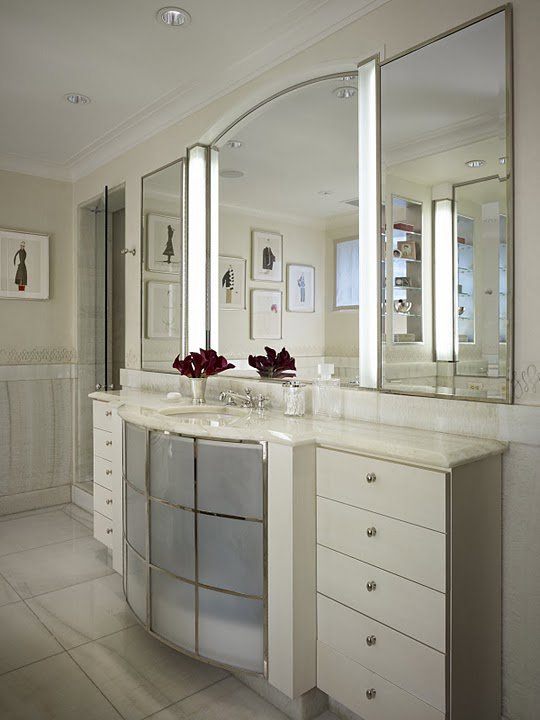 A luxurious bathroom vanity with custom mirrors and cabinetry, completed by S.N. Peck Builder, Inc. in Chicago, IL.