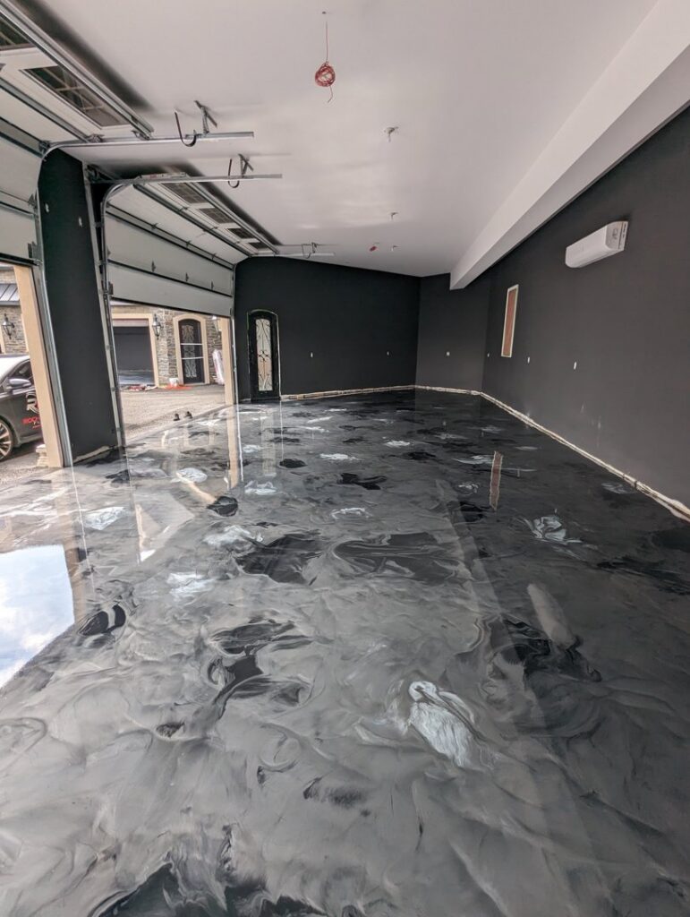 A luxury garage interior renovation with a custom epoxy floor by Roche Epoxy Floors in Allentown, PA.
