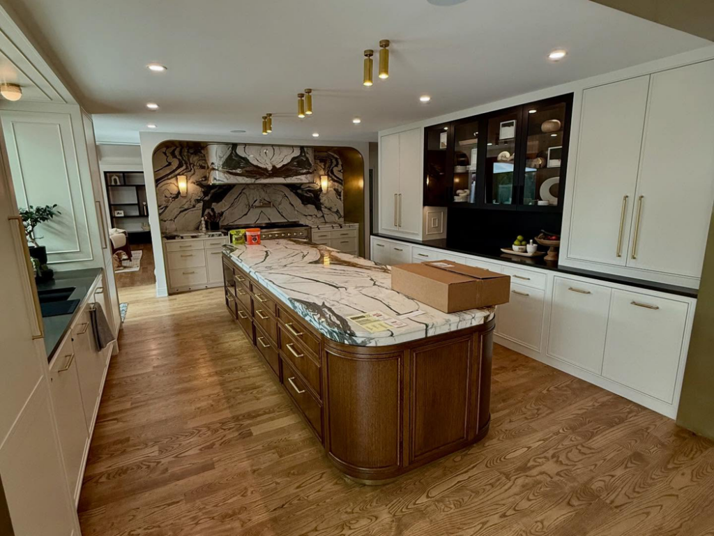 A luxurious kitchen featuring a large island and custom cabinet installation by Red Beard Cabinets in Kansas City, MO.