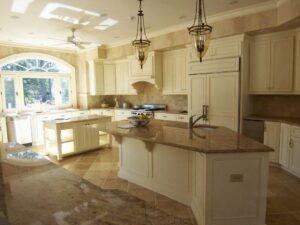 A spacious and luxurious completed kitchen remodel with multiple islands and high-end finishes by Rice Building Company in Rocky Mount, NC.