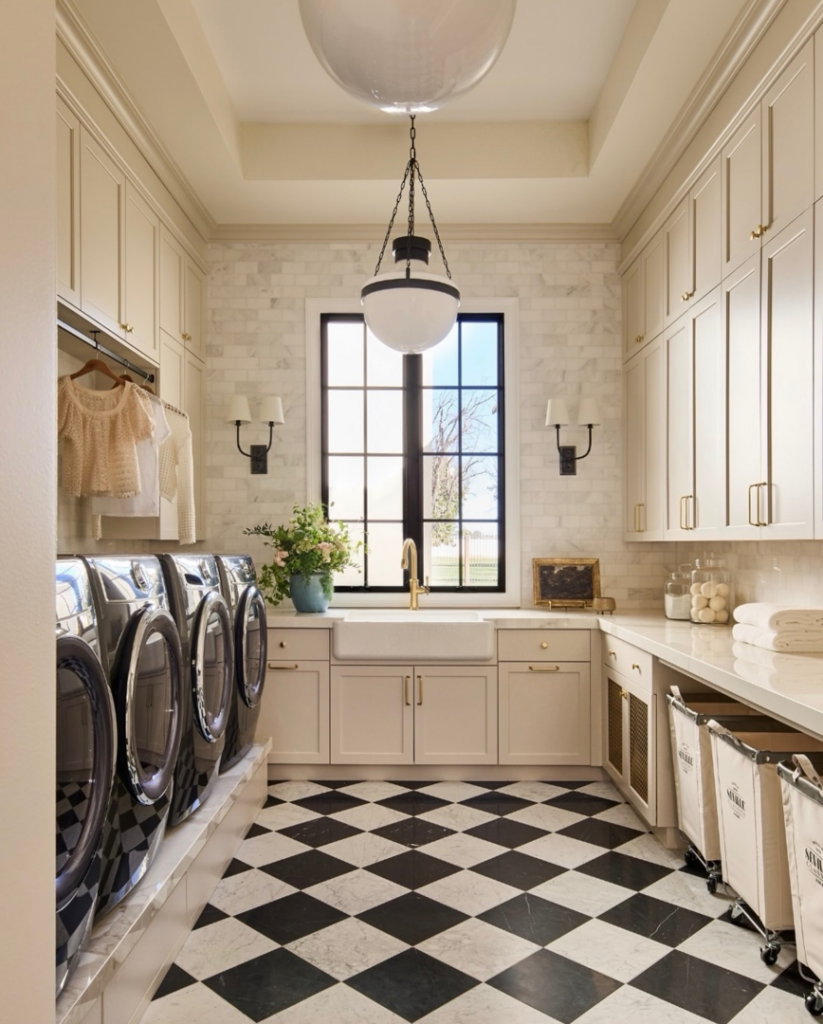 A luxurious laundry room remodel with custom cabinetry and checkered floor by Hammer Construction Services in Boca Raton, FL.