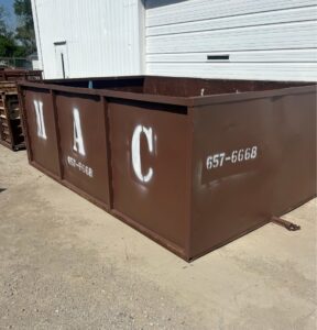 A MAC Containers, Inc dumpster ready for rental and junk removal in Omaha, NE.