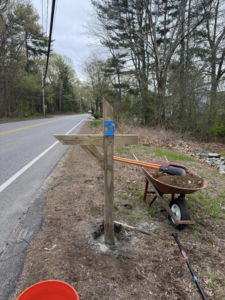A newly installed wooden mailbox post with tools nearby, a service by Daniels Handyman Services in Warwick, RI.