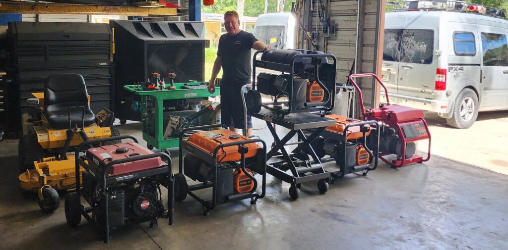 A man standing in a garage surrounded by generators and equipment, performing repairs for Tim's Maintenance & Repair in Las Vegas, NV