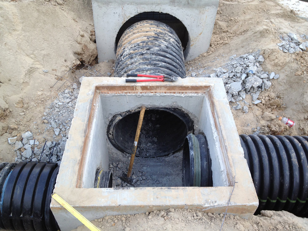 Manhole and drainage pipe installation in progress by Daniel Dean Land Clearing & Dirt Work in Houston, TX.