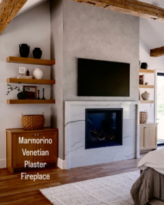 A modern bedroom featuring a beautiful Marmorino Venetian Plaster fireplace by Plasters of Italy in Plano, TX