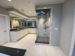 A spacious master bathroom remodel with dual vanity and a large walk-in shower by Home Platinum Services, LLC in Plano, TX