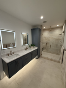 A master bathroom with double vanity and walk-in shower installation by Swiss Construction in Medford, OR