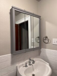 A new medicine cabinet installed above a bathroom sink by HandyMation in Cheyenne, WY