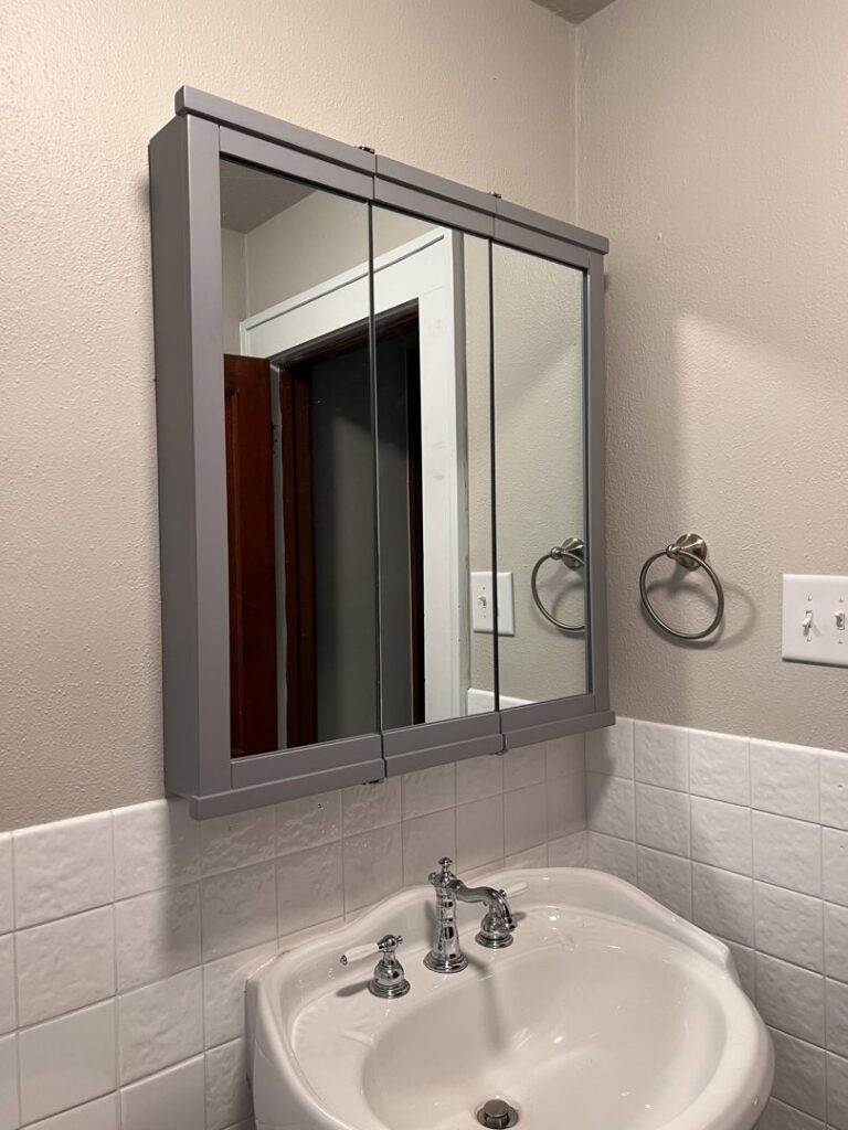 A new medicine cabinet installed above a bathroom sink by HandyMation in Cheyenne, WY
