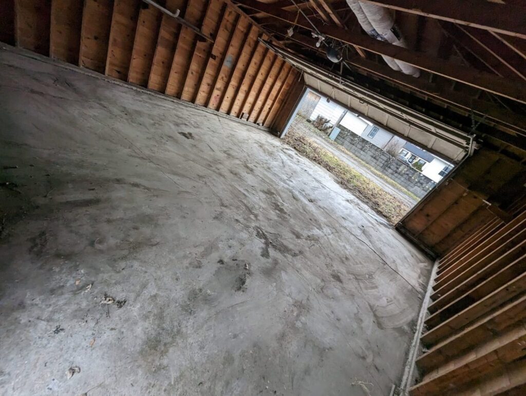 A clean and empty garage after a junk removal service by Merica JunkBoss LLC in Gary, IN.