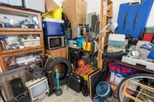 A very messy garage packed with various items and clutter, ready for junk removal in Frederick, MD.