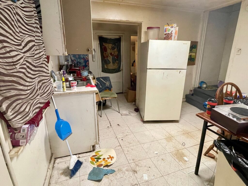 A messy kitchen with items scattered on the floor and counters, ready for a cleanout by Removall Residential and Commercial Cleanout Services in York, PA.