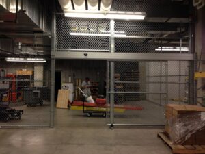 Workers installing a new metal canopy or roof structure by Security Fence & Construction Inc in Minneapolis, MN.