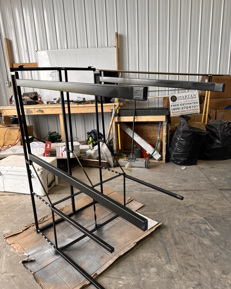 A metal frame being fabricated or repaired in a workshop by Devil Dog Services LLC in Billings, MT.