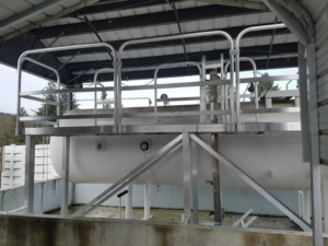Robust metal platform structure built over an industrial tank by Northwest Access Products LLC in Castle Rock, WA.