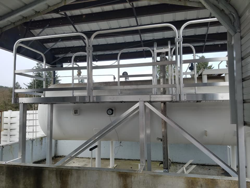 Robust metal platform structure built over an industrial tank by Northwest Access Products LLC in Castle Rock, WA.