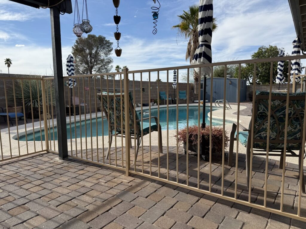A metal pool fence installation by Affordable Fence & Gates in Tucson, AZ.