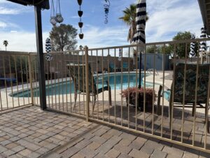 A metal pool fence installation by Affordable Fence & Gates in Tucson, AZ.