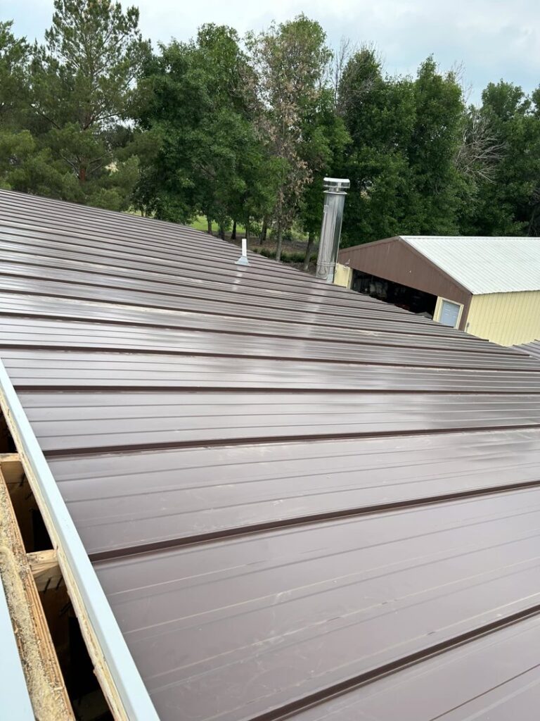 Close-up view of a new metal roof installation by Vander Wal Contracting, LLC in Bismarck, ND