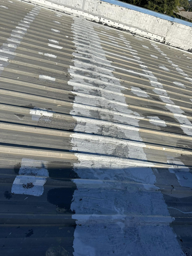 Metal roof sealing and repair work completed by Knight Construction Services in Brick, NJ.