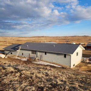 Metal roof and siding installation on a long rural building by RC Contracting in Chesterfield, MO.