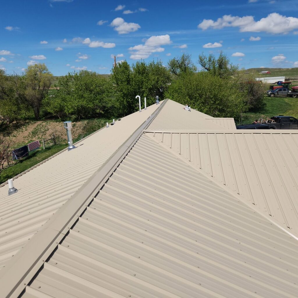 Light-colored metal roof with vents installed by RC Contracting in Chesterfield, MO.