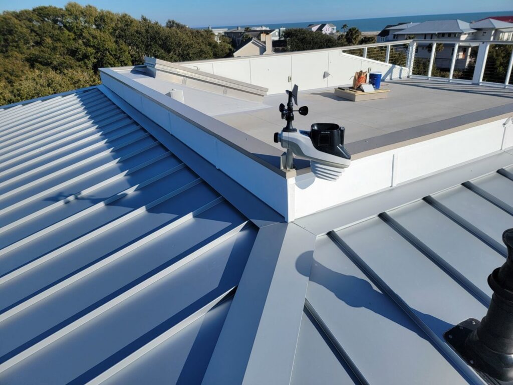 Close-up of a modern metal roof with a weather station by American Custom Exteriors in North Charleston, SC.