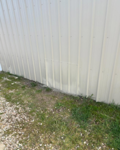 A close-up of a metal siding repair completed by Syd's Handyman Services in Oxnard, CA.