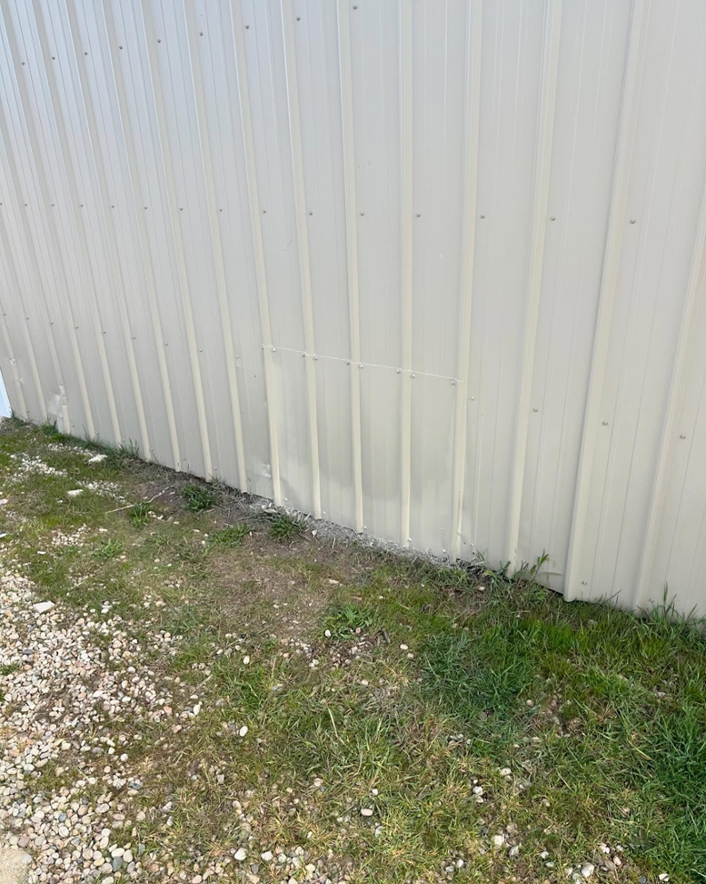 A close-up of a metal siding repair completed by Syd's Handyman Services in Oxnard, CA.