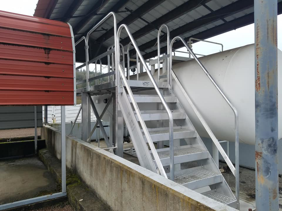 Comprehensive metal staircase and platform access system for an industrial tank by Northwest Access Products LLC in Castle Rock, WA.