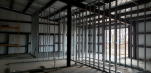Metal stud framing for interior walls in a commercial building by CCS Tulsa, OK