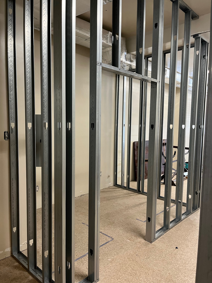 Metal stud wall framing in progress for a commercial renovation project by Pharos Contracting Company Inc. in Newark, NJ
