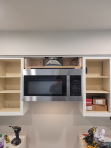 Internal view of microwave vent ducting and framing during installation by Precision Craftsman LLC in San Antonio, TX.