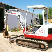 A mini excavator used for trenching and digging by Upright Services Inc in Green Bay, WI.