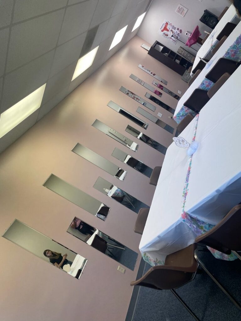 Multiple decorative mirrors professionally mounted on a wall in a commercial space by IFixdIt Handyman Services in Omaha, NE.