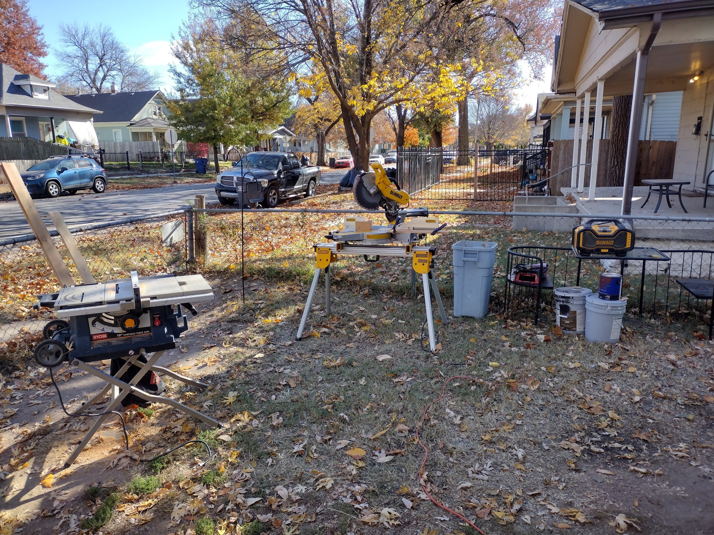 A miter saw and table saw set up outdoors for a construction project by Do-N-All Handyman Service in Wichita, KS.