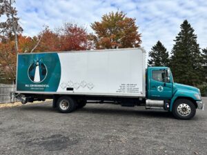 A branded MLi Environmental truck, ready for junk removal services in South Portland, ME.