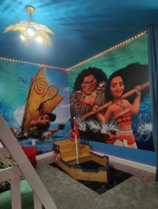A Moana themed child's bedroom renovation featuring custom wall murals and a boat-shaped bed by Dr.House in Orlando, FL