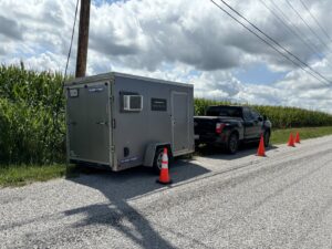 A mobile fiber splicing trailer on a job site at sunset, used by KPL Fiber Solutions LLC for general contracting in Houston, TX.
