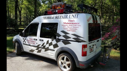 A white mobile repair unit van with Tim's Maintenance & Repair branding and checkered flag design in Las Vegas, NV