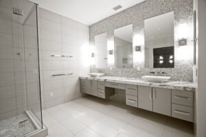 Modern bathroom with double vanity, vessel sinks, and glass shower by Charter Bay Home Builders in Tampa, FL