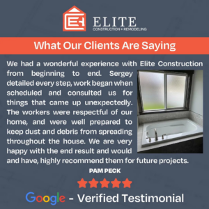 A modern bathroom remodel featuring a sleek bathtub and window completed by Elite Construction + Remodeling in Spokane, WA.